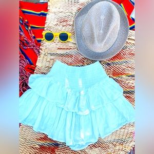 I’m selling a mini skirt, cover-up, with a little short underneath.